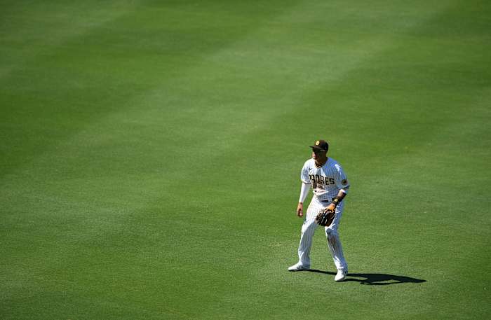 Jul 27, 2020; San Diego, California, USA; San Diego Padres third baseman Manny Machado (13) plays in shallow right field on a defensive shift on Arizona Diamondbacks left fielder David Peralta (not pictured) during the sixth inning at Petco Park. Credit: Orlando Ramirez-USA TODAY Sports